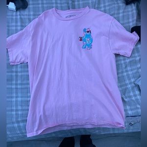 pink shirt with blue gummy bear design